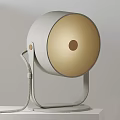 Modern Design Table Lamp With Round White Shade Warm Light Inside Brown Dot Center And Metal Stand Braided Cord