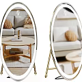 Oval LED Lit Floor Mirrors With Gold Stands In Living Room