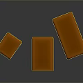 Three Square Caramel Colored Candies With White Filling On Dark Surface 3d model