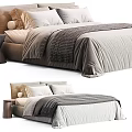 Modern Double Bed Setup With Neutral Tones Bedding Knitted Blanket Pillows And Nightstand