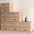 Stacked Wooden Storage Cabinet Shelves With Multiple Drawers And Decorative Vase On Top