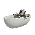 White Oval Bathtub with Wooden Tray Holding Candle Vase Flowers and Book
