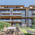 Modern Townhouse Exterior Design With Balconies Swimming Pool And Lush Greenery