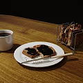 Toast With Jam On White Plate And Black Coffee Alongside Metal Toaster On Wooden Table