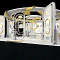 Elegant Modern Exhibition Hall with Golden Decorations and Glass Display Showcases