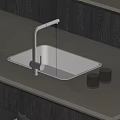 Modern Black Kitchen Sink With Brushed Nickel Faucet On Light Gray Countertop And Glass Tumblers