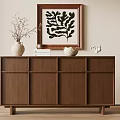 Wooden Cabinet Featuring White Vase Books Woven Basket And Black Abstract Painting On Beige Wall