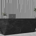 Modern Black Marble Reception Desk With Geometric Design Laptop And Green Plant