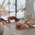 Cozy Restaurant Dining Table With Brown Chairs Cookies Tea Vase And Green Plants By Window