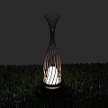 Outdoor Lamp with Branch Like Metal Frame Design and Illuminated White Light in Green Grass