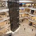 Modern Shopping Mall Interior With Open Space Escalator Glass Walls And Bright Lighting