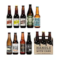 Assorted Craft Beer Bottles With Various Labels In Handle With Care Cardboard Box