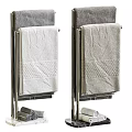Soft Textured Cotton Towels In White And Gray Hanging On Chrome Rack With Folded Design