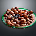 Assorted Mixed Nuts Placed On A Glass Plate With Orange Nutcracker