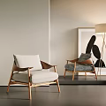 Stylish Modern Armchair Interior With White Cushions Wooden Frame Floor Lamp And Wall Art