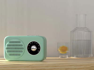 Light Green Radio On Wooden Tabletop With Clear Glass Bottle And Small Glass 3d model