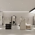 Modern Clothing Store Front With Glass Window Mannequins And Hanging Outfits