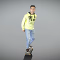 Man wearing yellow hoodie with black text DR SAVAGE on skateboard against gray background