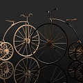Vintage Metallic Bicycles With Large Front And Small Rear Wheels On Reflective Surface