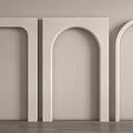 Three White Arches With Different Shapes Against Light Colored Wall And Wooden Floor
