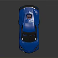 Blue Corvette Sports Car With Rear Spoiler And Black Performance Wheels