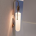Minimalist Modern Wall Sconce With Metal Frame White Shade And Light Shadow On Textured Wall