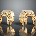 Two Shiny Golden Eagle Head Sculptures With Detailed Feather Design