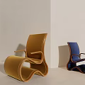 Modern Curved Accent Chairs in Yellow and Blue Upholstery With Cactus Plant in Minimalist Interior