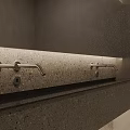 Modern Sleek Bathroom Faucet On Terrazzo Countertop With Gray Walls And Lighting