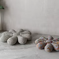 Flower Shaped Cushions With Checkered And Floral Patterns On Gray Floor 3d model