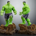 Two Green Hulk Statues With Muscular Bodies Tattered Shorts And Rock Bases