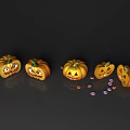 Carved Pumpkins with Different Carved Faces and Reflections on Dark Background with Candies