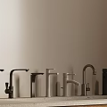 Multiple Black And White Faucets Arranged Against Grey Background