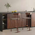 Modern Bar Counter Featuring Wooden Cabinets Black Countertop Green Plant Yellow Fruits And Bar Stools