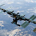 International Space Station With Solar Panels Orbiting Earth Atmosphere 3d model
