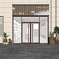 Elegant Storefront Facade Featuring Glass Double Doors Decorative Sign And Potted Plants On Stone Pavement