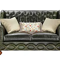 Vintage Green Leather Tufted Sofa With Rolled Arms Wooden Legs And Patterned Cushions