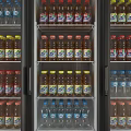 Organized Refrigerator Interior with Neatly Arranged Bottled Drinks on Shelves and Colorful Caps