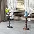 Black and Brown Side Tables with Decorative Items Near Window Natural Light
