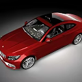 Red Modern Coupe Car With Black Roof Sleek Design And Silver Wheels