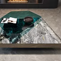 Modern Coffee Table With Green Glass And Marble Top Featuring Magazines And Bowl