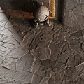 Natural Gray Stone Pavement With Irregular Slabs And Ornate Carved Sculpture