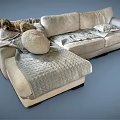 Modern Sectional Sofa With Soft Beige Fabric Cushions And Decorative Throw Blanket 3d model