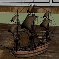 Wooden Sailboat Model With Multiple Sails And Detailed Hull On Indoor Floor