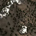 Natural Mountain Landscape With Snow Covered Areas Rocky Terrain And Brown Land