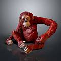 Realistic Red Orangutan Statue Sitting With Detailed Textured Surface On Gray Background