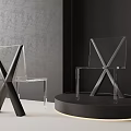 Transparent Acrylic Dining Chairs With X Shaped Design On Black Display Platform