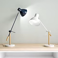 Navy Blue and White Table Lamps with Wooden Handles White Bases on Wooden Tabletop