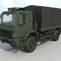 Green Military Transport Truck With Canvas Covered Cargo Area And Cab