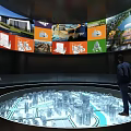 Interactive Exhibition Hall Featuring Circular Platform City Model Large Screen Visuals And People Observing 3d model